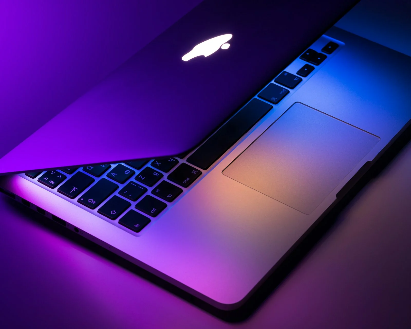 MacBook Pro in neon light
